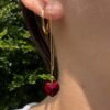 Gold crystal heart threader earring with red heart pendant, lightweight and minimalist.