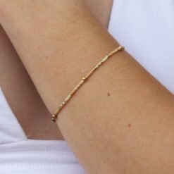 Cream, peach and gold bracelet made with Miyuki glass seed beads.