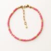 Close-up of the Cairo Pink Bracelet featuring soft pink Miyuki beads with gold accents and a gold clasp on a neutral background.